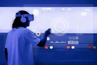 man-with-vr-headset-touching-holographic-screen(1).webp