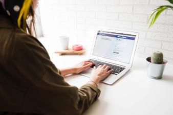 woman-login-into-facebook-website-laptop(1).jpg